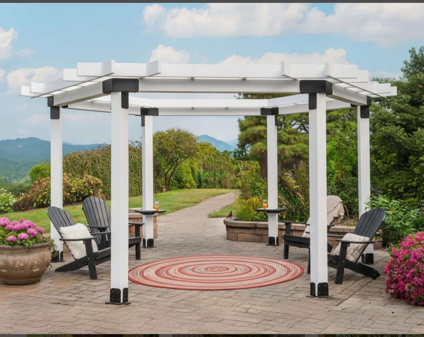 White pergola over a patio with chairs and mountain views